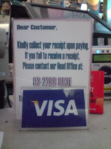 The mini sign next to the cashier